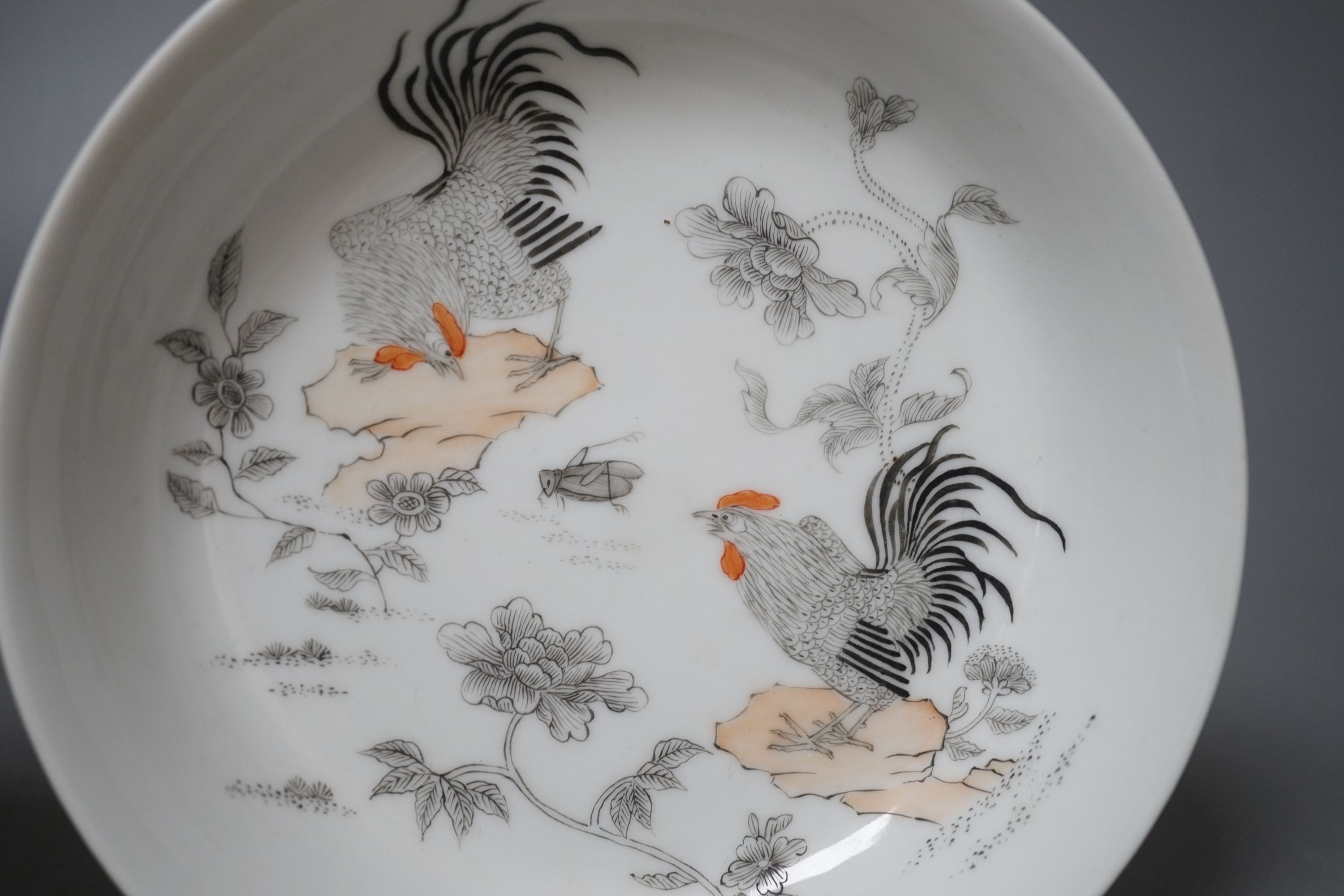 A pair of Chinese rouge de fer saucer dishes, 14 cm diameter